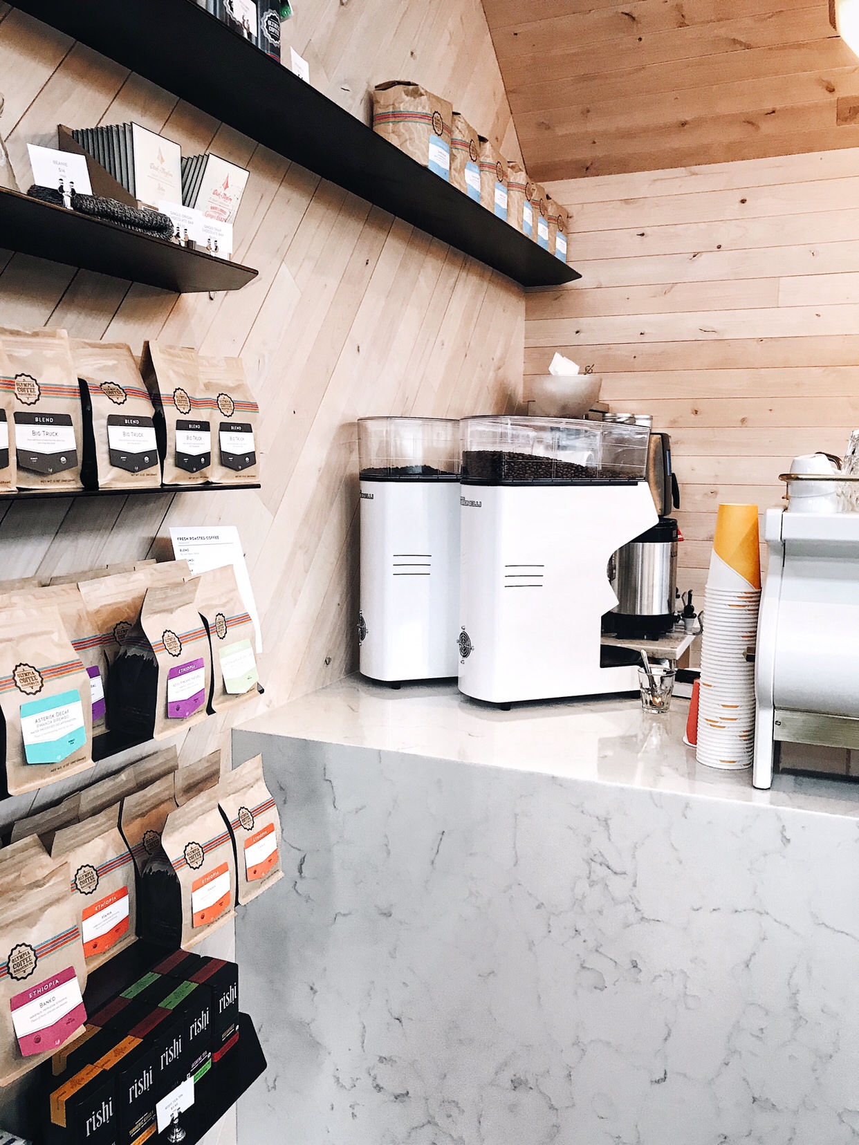 Olympia Coffee Roasters new cafe in West Seattle with marble countertops and sustainable wood siding | beccarisaluna.com